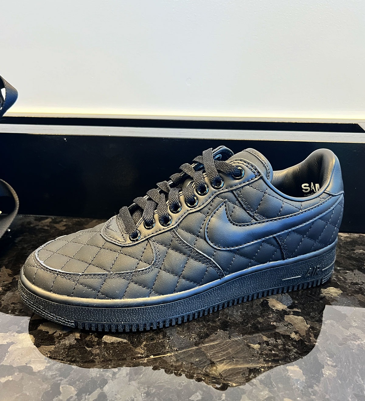Nike Air Force 1 Low Quilted in all-black, side view