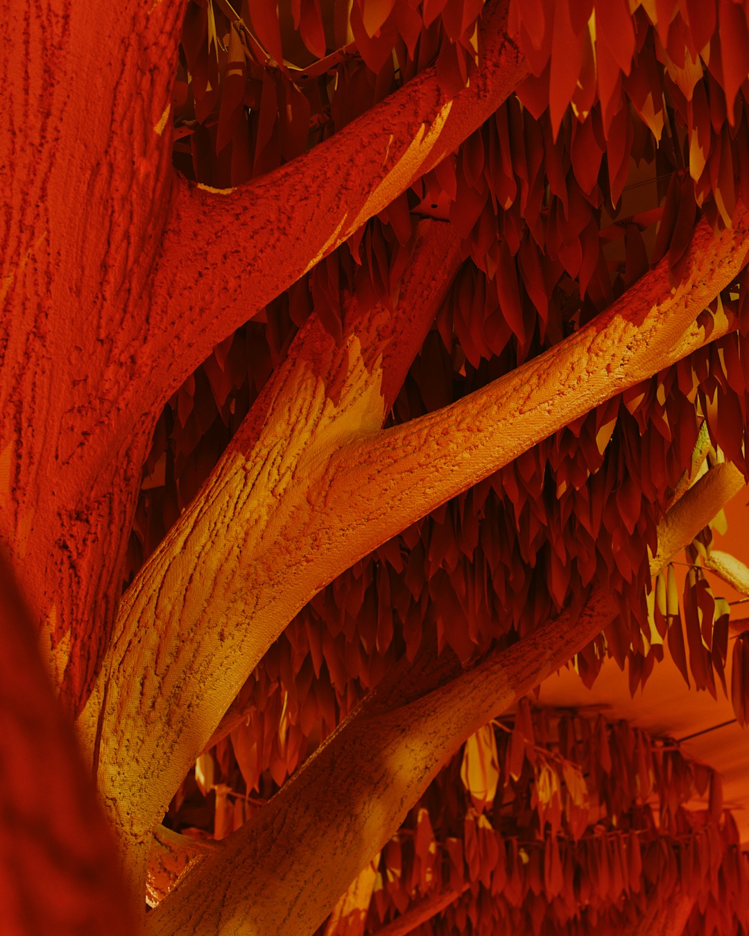 Tree bark set design detail at the Vansza NYFW activation