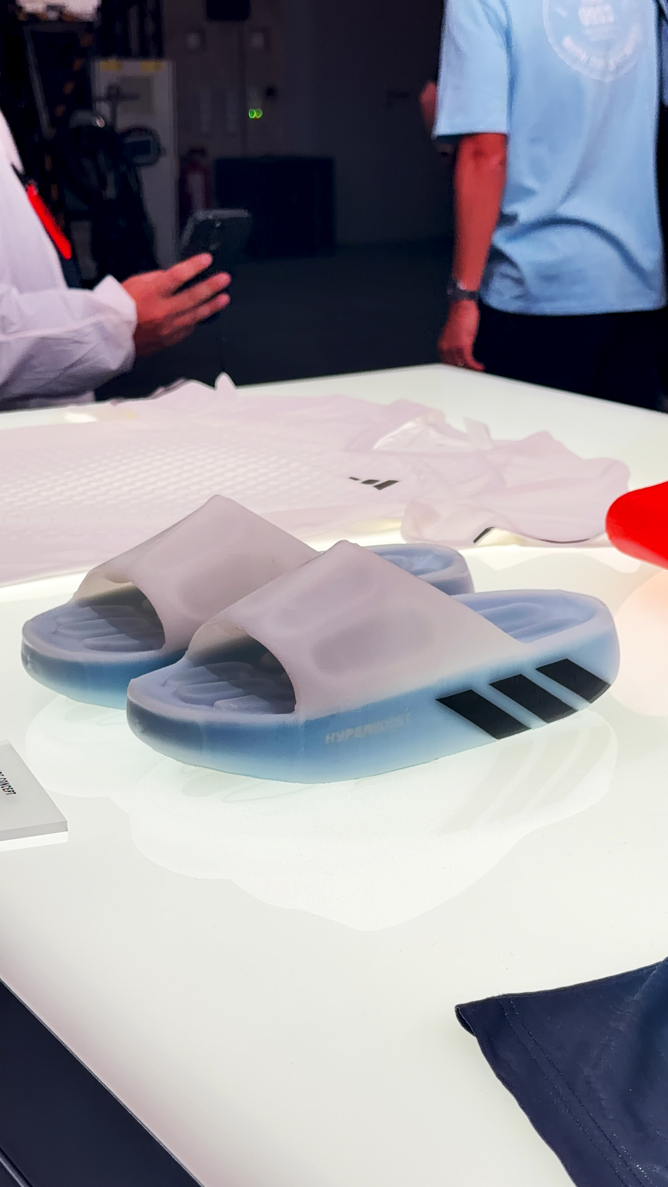 A pair of adidas Climacool Recovery Slides