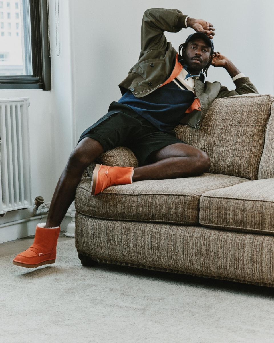 Dev Hynes wearing the UGG x JW Anderson Loafer Boot in Orange