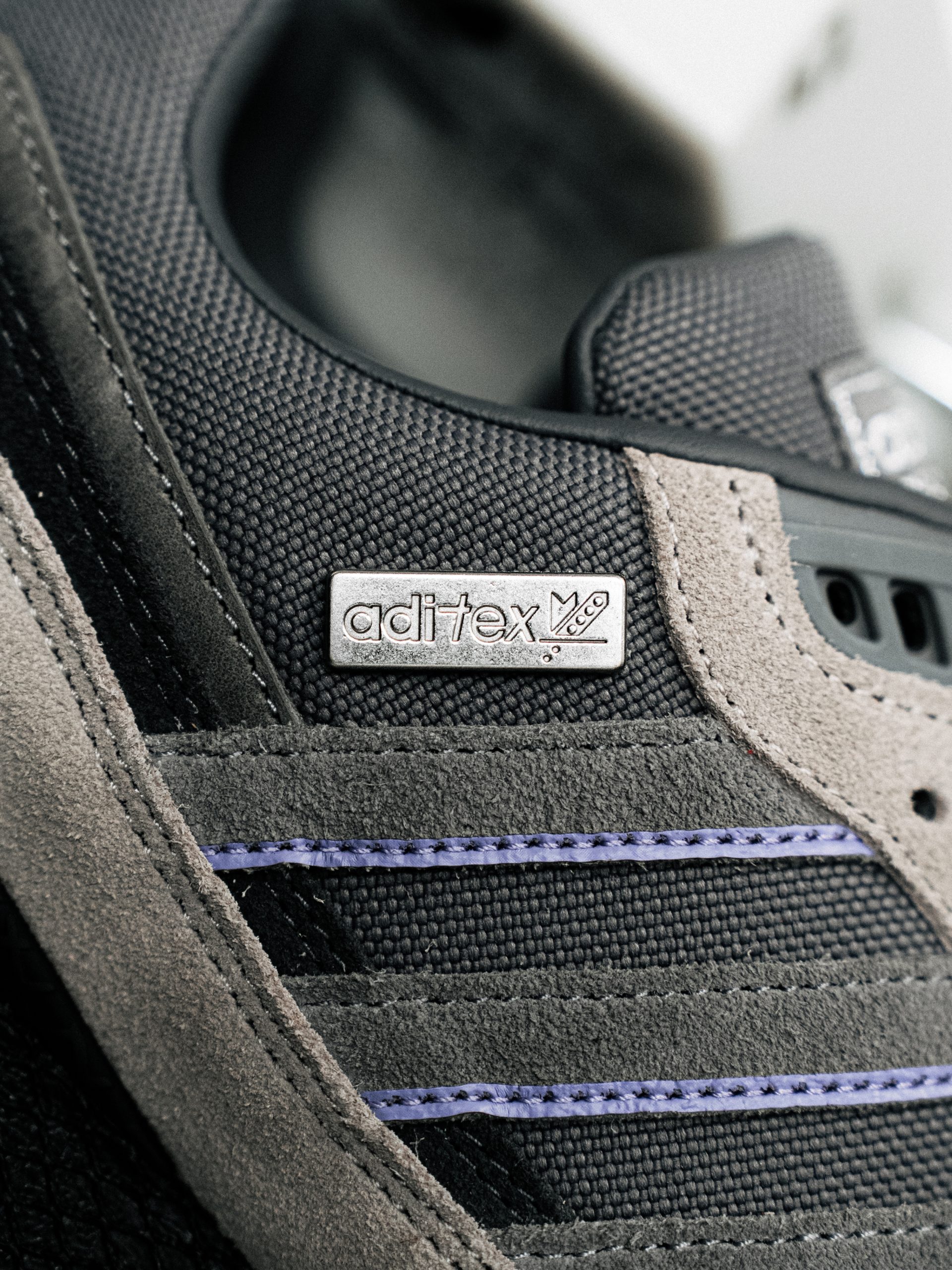 Metal Aditex badge on the grey pair