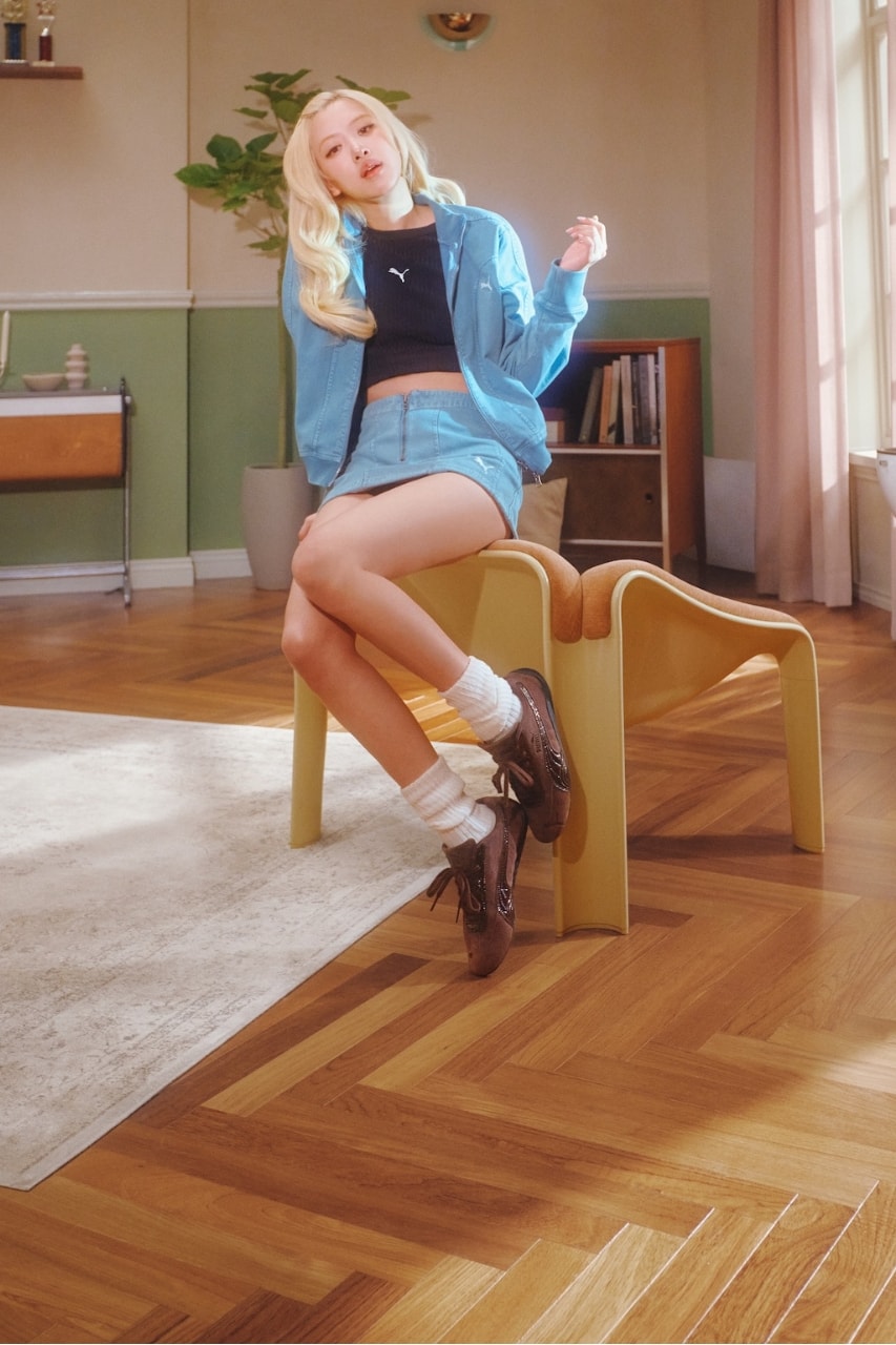 ROS&Eacute; seated on a retro chair in the PUMA Speedcat Croc