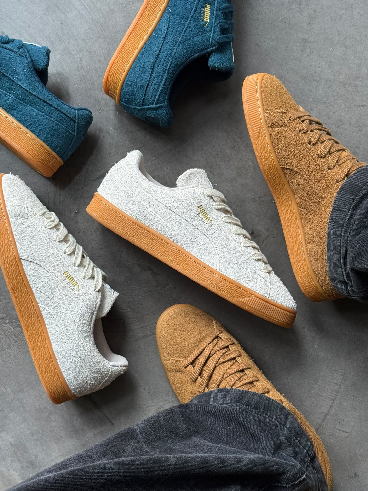 PUMA Suede Forever on feet surrounded by the other colourways