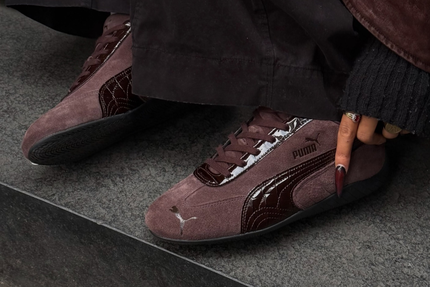 Close-up of the PUMA Speedcat Croco in Chocolate Fondue on feet with croc-effect leather Formstrip