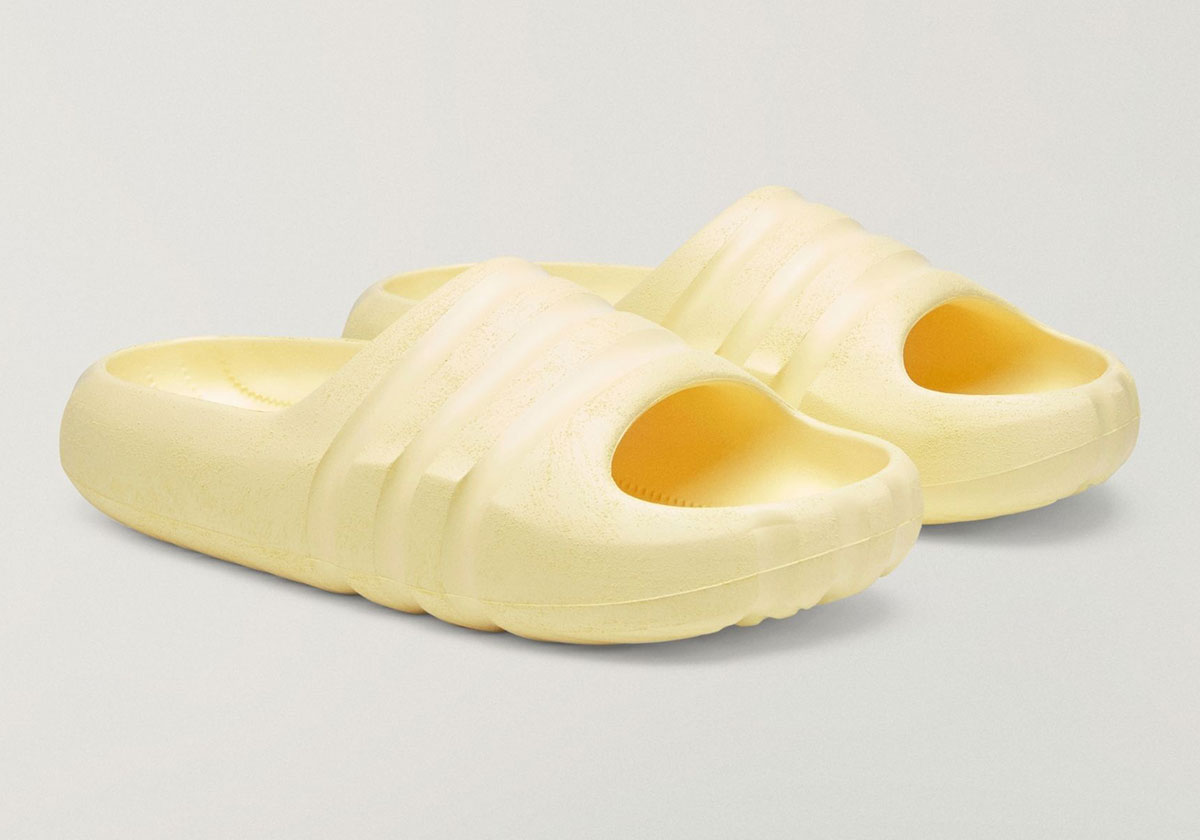Pair of Bad Bunny x adidas BadBo Stone Slides in yellow