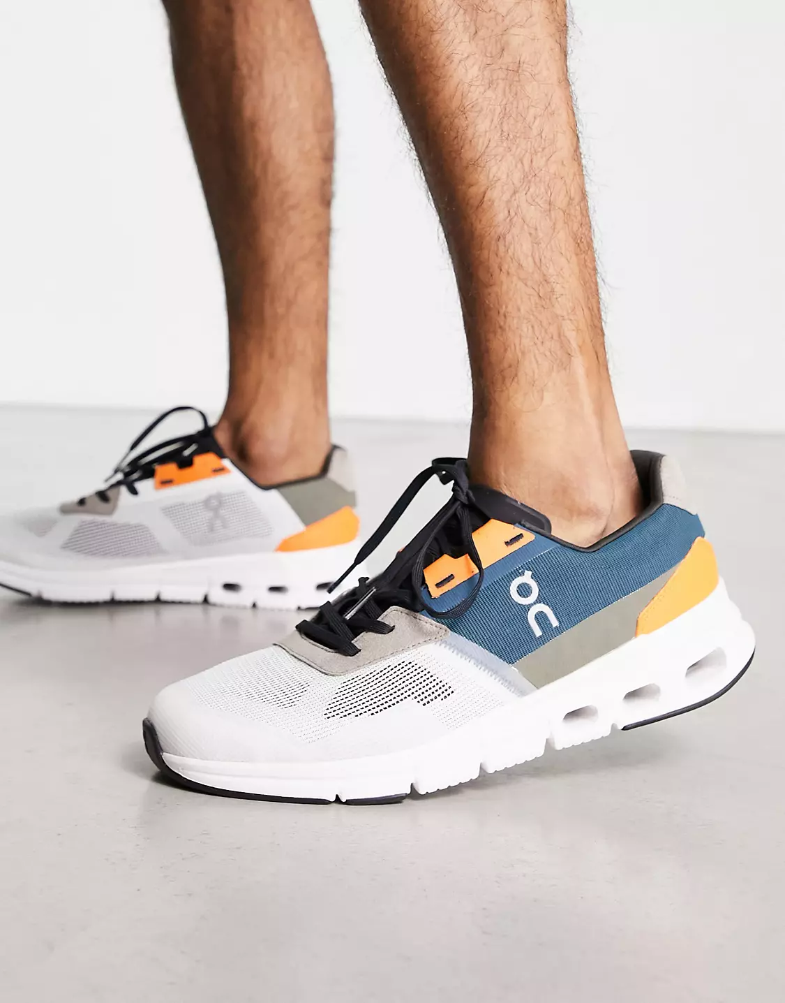 On Cloudrift sneakers on feet