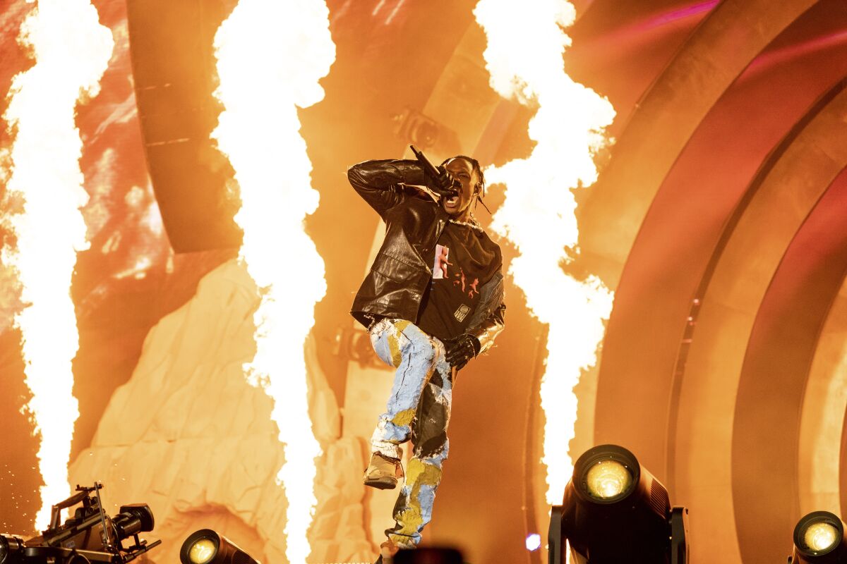 Travis Scott performing on stage